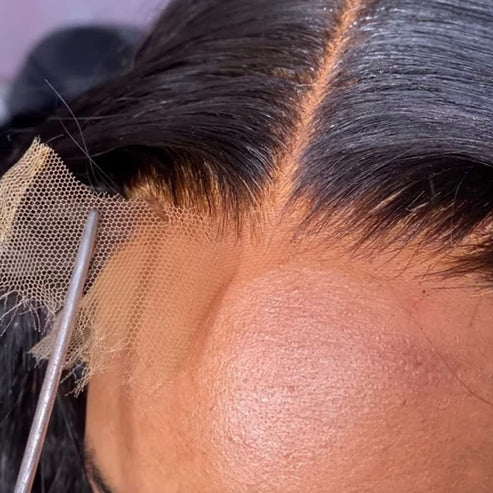 Straight Free Parted Lace Closure being expertly applied near the hairline for a natural look.