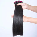 Raw Cambodian Bone Straight Hair Bundles held in hand, showcasing smooth, silky texture and high luster.